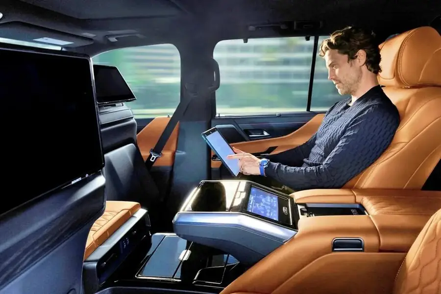 Long distance executive transportation with passenger working inside luxury SUV
